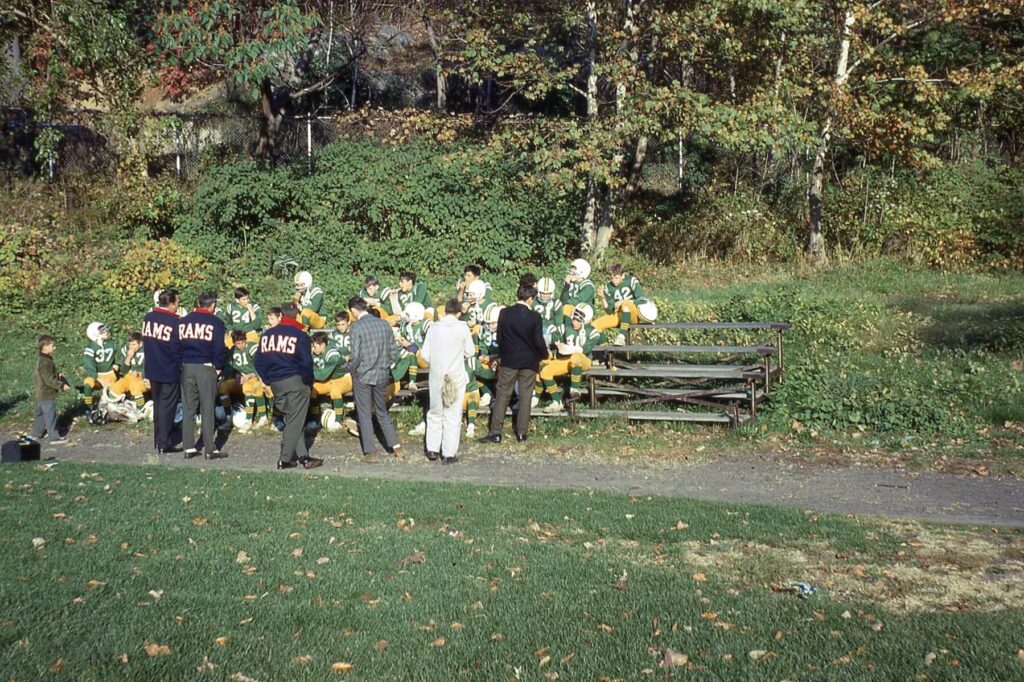 Hastings Rams going over strategy at halftime of a Rams Football game at Reynolds Field in 1967