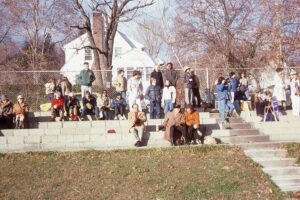 Crowd watching Thanksgiving weekend soccer alumni game in 1978
