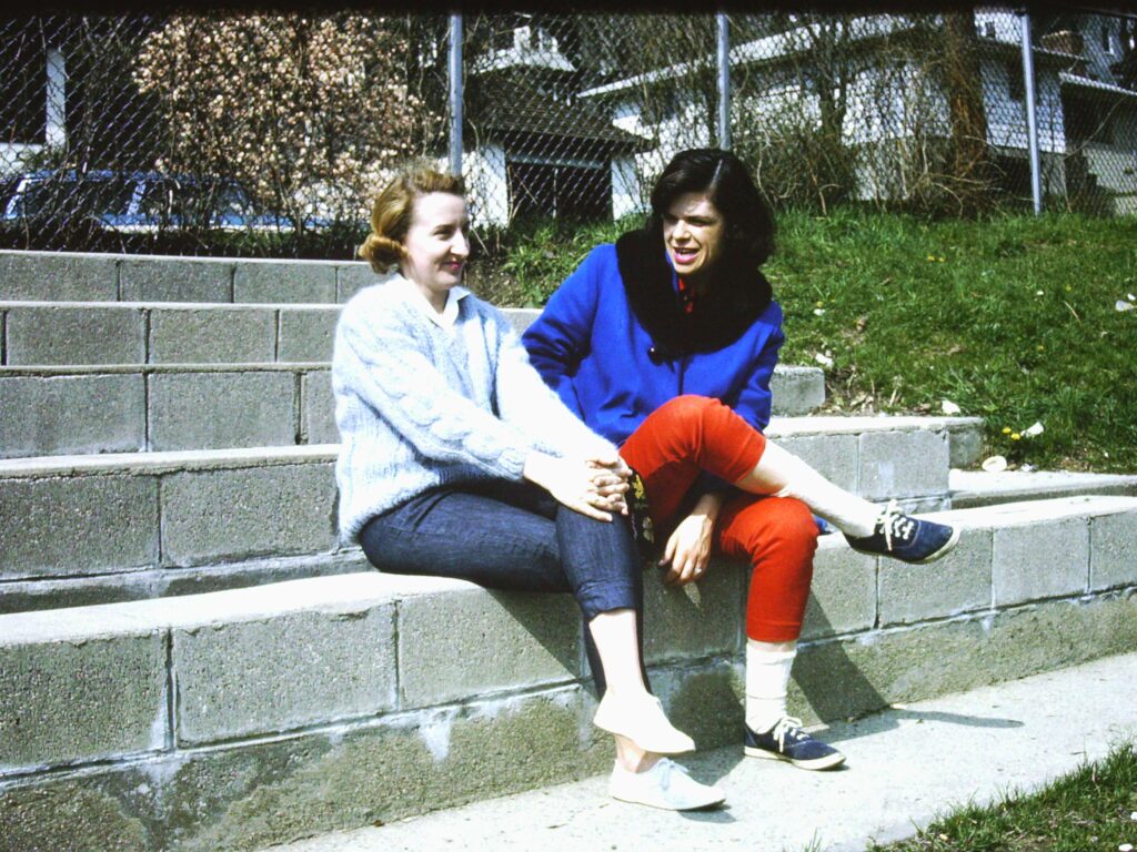 Mrs. Glassman and Dotty Bingham in the Reynolds Field Bleachers