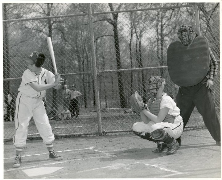 A batter, catcher, and umpire in what appears to be a Pony League game in the 1950’s.
