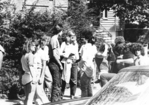 Group of students hanging out in front of the high school circa 1980