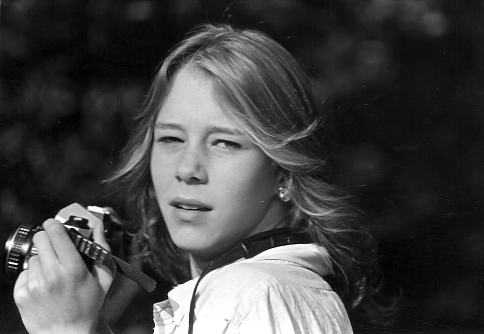 Melissa Hall, holding a camera, in a photo circa 1980.