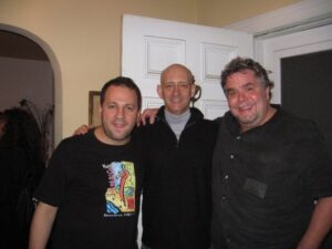 Three guys from HHS 1976 at a party circa 2008.