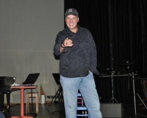 Paul Baya, HHS 1991, on the high school stage during a school tour during his 20th reunion in 2011.