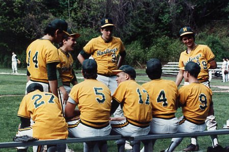 Group shot of Hastings Varsity Baseball team in 1990 on the bench.