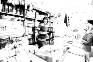 John Fagan behind the counter of Logue’s Delicatessen in the 1970’s