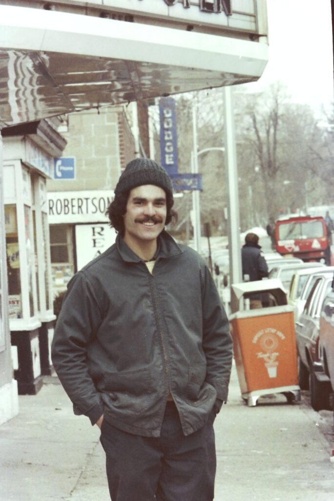 Man in front of the Hastings movie theater in the 1970’s