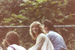 I believe it is Joanne Liakos looking at the camera.  Harry Liakos and John Fagan next to her.